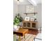 Light-filled living room with hardwood floors and mid-century modern furniture at 2610 Poplar St, Denver, CO 80207