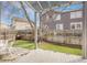 Relaxing backyard featuring a patio area, well-maintained lawn, and a wooden fence for added privacy and security at 20630 E Ithaca Pl, Aurora, CO 80013