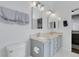 Bright bathroom featuring double sinks, granite countertops, and modern fixtures for a luxurious feel at 20630 E Ithaca Pl, Aurora, CO 80013