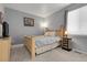 Cozy bedroom with soft gray walls, plush carpet, and a comfortable bed at 20630 E Ithaca Pl, Aurora, CO 80013