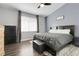 Comfortable primary bedroom with hardwood floors, vaulted ceiling, and lots of natural light at 20630 E Ithaca Pl, Aurora, CO 80013