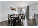 The dining room features a dining table, chairs, hanging light fixture, picture on the wall and sliding glass doors at 20630 E Ithaca Pl, Aurora, CO 80013