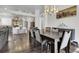 Open-concept dining room featuring hard wood floors and easy access to kitchen at 20630 E Ithaca Pl, Aurora, CO 80013