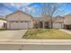 Charming single-story home featuring a two-car garage and well-maintained front yard at 20630 E Ithaca Pl, Aurora, CO 80013