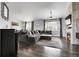 Spacious living room with hardwood floors, fireplace, and large windows for natural light at 20630 E Ithaca Pl, Aurora, CO 80013