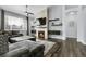 Stylish living room with a modern fireplace, TV, and sleek floating shelves at 20630 E Ithaca Pl, Aurora, CO 80013