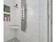 Modern shower with sleek fixtures, tiled walls, and a built-in seat for a comfortable and stylish experience at 20630 E Ithaca Pl, Aurora, CO 80013