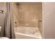 Well-maintained bathroom featuring a shower-over-tub and tiled walls at 1700 Bassett St # 2117, Denver, CO 80202