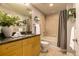 Bright bathroom featuring granite counters, a bathtub with shower, and neutral tile flooring at 1700 Bassett St # 2117, Denver, CO 80202