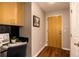 Functional entryway with desk area and wood-look flooring near the entry door at 1700 Bassett St # 2117, Denver, CO 80202
