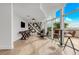Inviting game room with a foosball table, lounge chairs, and city views through expansive windows at 1700 Bassett St # 2117, Denver, CO 80202