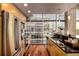 Well-equipped kitchen featuring stainless steel appliances, ample counter space, and city views at 1700 Bassett St # 2117, Denver, CO 80202