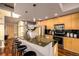 Gourmet kitchen with stainless steel appliances, granite countertops, and bar seating at 1700 Bassett St # 2117, Denver, CO 80202