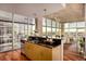 Modern kitchen with stainless steel appliances and a breakfast bar overlooking the living area at 1700 Bassett St # 2117, Denver, CO 80202