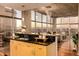 Stylish kitchen with large windows offering city views, granite countertops, and pendant lighting at 1700 Bassett St # 2117, Denver, CO 80202