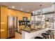 Bright kitchen with stainless steel appliances, modern cabinetry, and bar stool seating at 1700 Bassett St # 2117, Denver, CO 80202