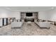 Stylish living room with modern sofas, decorative pillows, and a flat-screen TV against a patterned wall at 1700 Bassett St # 2117, Denver, CO 80202