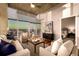 Bright living room showcasing open layout, views, and modern decor, adjacent to bedroom at 1700 Bassett St # 2117, Denver, CO 80202