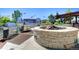 Outdoor grill area with built-in BBQ, stone fire pit, and city views for alfresco cooking and entertaining at 1700 Bassett St # 2117, Denver, CO 80202