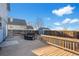 Large deck in the backyard, offering space for seating and relaxation at 55429 E 31St Ave, Strasburg, CO 80136