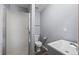 Modern bathroom featuring a sleek vanity and standup shower with glass door and neutral walls at 55429 E 31St Ave, Strasburg, CO 80136