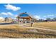 Community picnic and recreation area with tables and green space at 55429 E 31St Ave, Strasburg, CO 80136