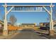 Entrance to the Wolf Creek Run neighborhood with a view of the community at 55429 E 31St Ave, Strasburg, CO 80136