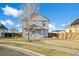 Lovely home with fenced yard, sidewalk, and blue skies creating an inviting atmosphere at 55429 E 31St Ave, Strasburg, CO 80136