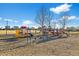 A community playground with colorful equipment and open space for children to play at 55429 E 31St Ave, Strasburg, CO 80136