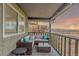 Cozy covered balcony furnished with a comfortable seating area and offering scenic views at 5761 W 50Th Ave, Denver, CO 80212