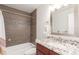 Modern bathroom featuring granite countertops and a tiled shower with tub at 5761 W 50Th Ave, Denver, CO 80212