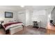 Serene bedroom with a comfortable bed, a workspace with desk, and natural light at 5761 W 50Th Ave, Denver, CO 80212