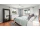 Serene bedroom with natural light, hardwood floors and stylish decor at 5761 W 50Th Ave, Denver, CO 80212