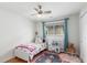 Brightly lit bedroom with hardwood floors and a play kitchen at 5761 W 50Th Ave, Denver, CO 80212