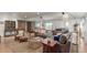 Spacious living room featuring modern decor, a pool table, and access to outdoor seating at 5761 W 50Th Ave, Denver, CO 80212