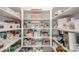 Organized pantry with neatly arranged shelves and storage containers for maximum storage and efficiency at 5761 W 50Th Ave, Denver, CO 80212