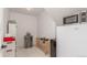 Pantry area with a refrigerator, microwave, wine racks, and shelving for storage at 5761 W 50Th Ave, Denver, CO 80212
