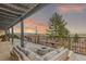 Serene outdoor patio with a fire pit and comfortable seating, ideal for relaxation with views at 5761 W 50Th Ave, Denver, CO 80212