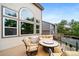 Relaxing deck area with comfortable seating and a fire pit table, perfect for outdoor gatherings at 9928 Sylvestor Rd, Highlands Ranch, CO 80129