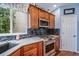 Bright kitchen area showcasing granite countertops, stainless steel appliances, and ample cabinet space at 9928 Sylvestor Rd, Highlands Ranch, CO 80129