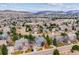 Aerial view of neighborhood showing winding streets and mountain views at 8 Mountain High Ct, Littleton, CO 80127