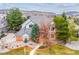 Beautiful brick home with well-kept yard surrounded by mature trees and scenic mountain views at 8 Mountain High Ct, Littleton, CO 80127