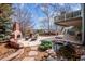 Backyard with brick fireplace, pond, and seating area provides a relaxing outdoor oasis at 8 Mountain High Ct, Littleton, CO 80127