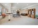 Large finished basement area with a ping pong table, fireplace, and plenty of room for entertaining at 8 Mountain High Ct, Littleton, CO 80127