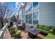 Outdoor deck with a dining table, seating area, and views of the backyard at 8 Mountain High Ct, Littleton, CO 80127