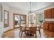 Bright dining area features hardwood floors and a sliding door to the backyard at 8 Mountain High Ct, Littleton, CO 80127