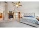 Carpeted main bedroom featuring a fireplace and neutral walls at 8 Mountain High Ct, Littleton, CO 80127