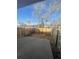 Fenced backyard featuring a concrete patio, planting area, and a natural setting at 11644 Community Center Dr # 126, Northglenn, CO 80233