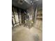 This unfinished basement displays visible pipes and utilities, providing a space for storage and future renovation at 11644 Community Center Dr # 126, Northglenn, CO 80233