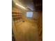 Unfinished basement space offers potential for customization and additional storage; note the existing shelving at 11644 Community Center Dr # 126, Northglenn, CO 80233